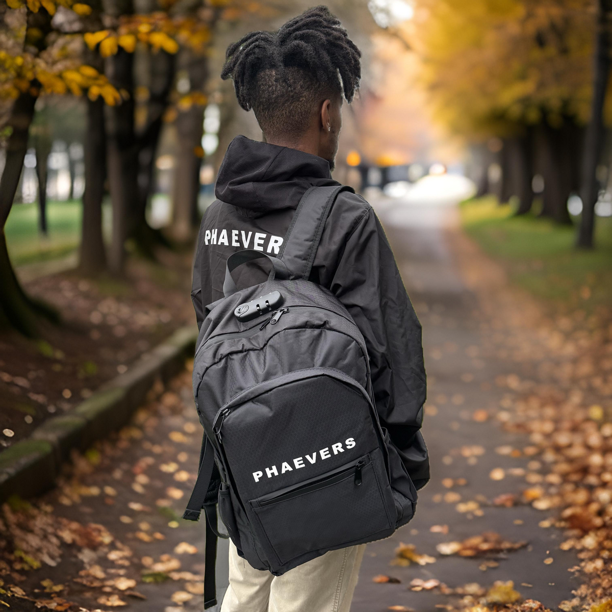 PHAEVERS black lockable smell proof backpack, 18 x 12 x 6 inches, featuring odor-resistant lining, combination lock, and a sleek, water-resistant design.  Being  worn by model